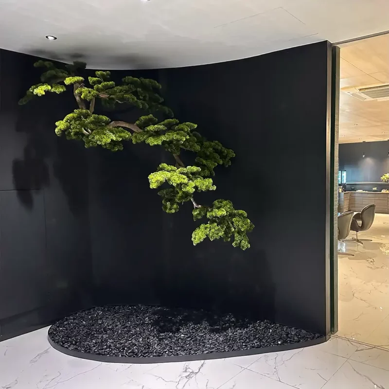 บอนไซประดิษฐ์จัดวางในมุมผนังสีดำของโชว์รูม Mercedes-Benz โดย Livingstyle Studio